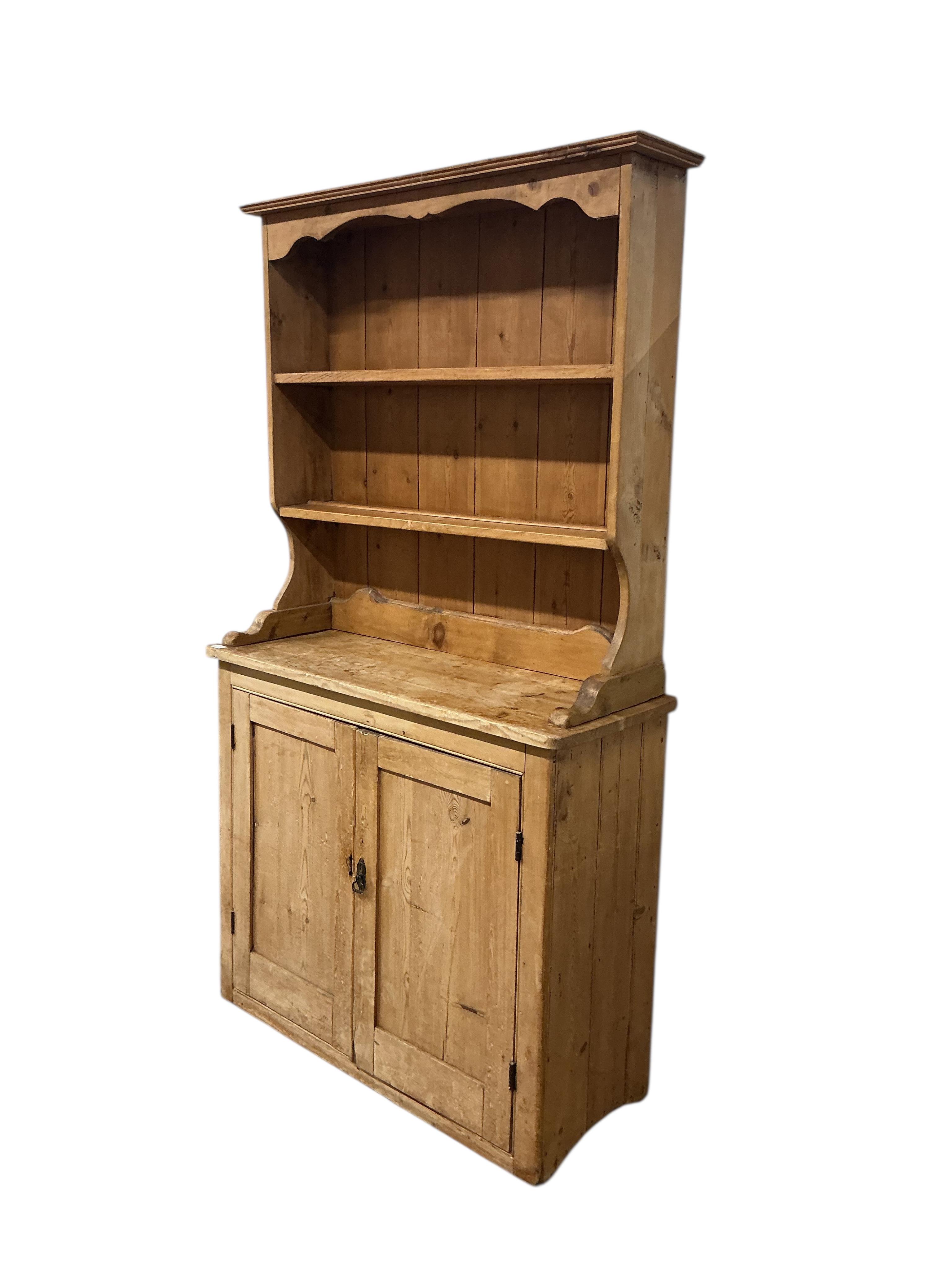A Victorian pine dresser with associated boarded rack, width 116cm, depth 45cm, height 207cm